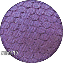 Stargazer pressed mineral eyeshadow in vibrant purple with smooth satin finish, shown in compact case