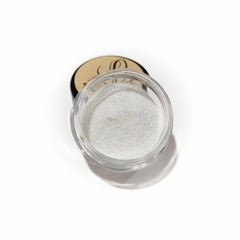 Side view of glitter glue makeup set with pink highlighter palette and angled brush