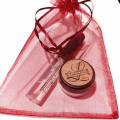 Glitter glue makeup set with glam face highlighter in sleek black compact and shimmering gold accents