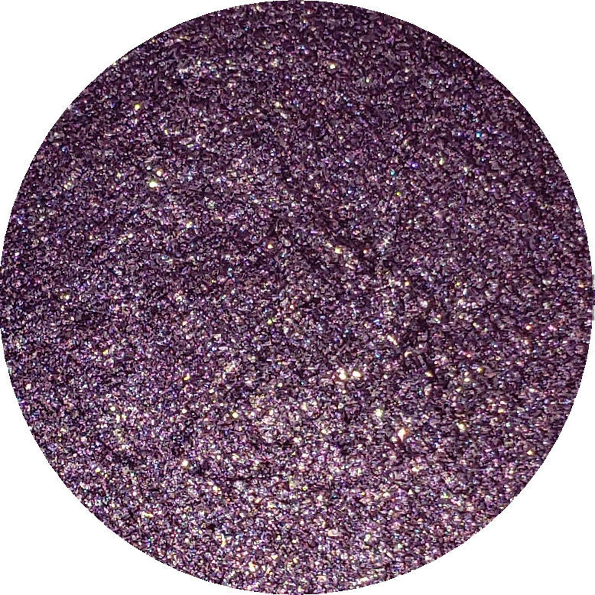 Close-up of Constellation Eye Shadow Palette showing twelve shimmering shades in cosmic colors with sleek black packaging