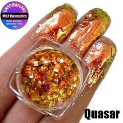 Close-up of Quasar Chromaflake Multichrome Eyeshadow Flakes in a jar, showcasing iridescent color-shifting pigments.