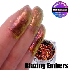 Close-up of Blazing Embers Chromaflake eyeshadow flakes showing multichrome shift from copper to emerald green