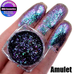 Close-up of Amulet Chromaflake eyeshadow flakes with multichrome shift in purple, green, and gold hues