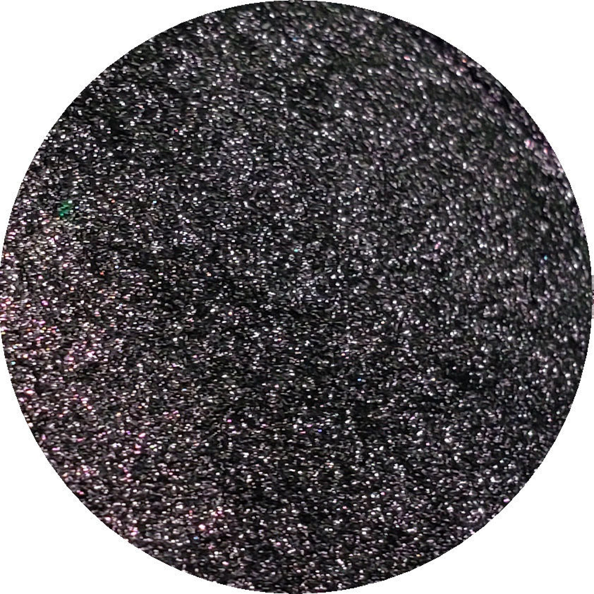 Close-up of shimmering bronze eye shadow palette with smooth, blendable powder texture