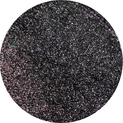 Close-up of shimmering bronze eye shadow palette with smooth, blendable powder texture