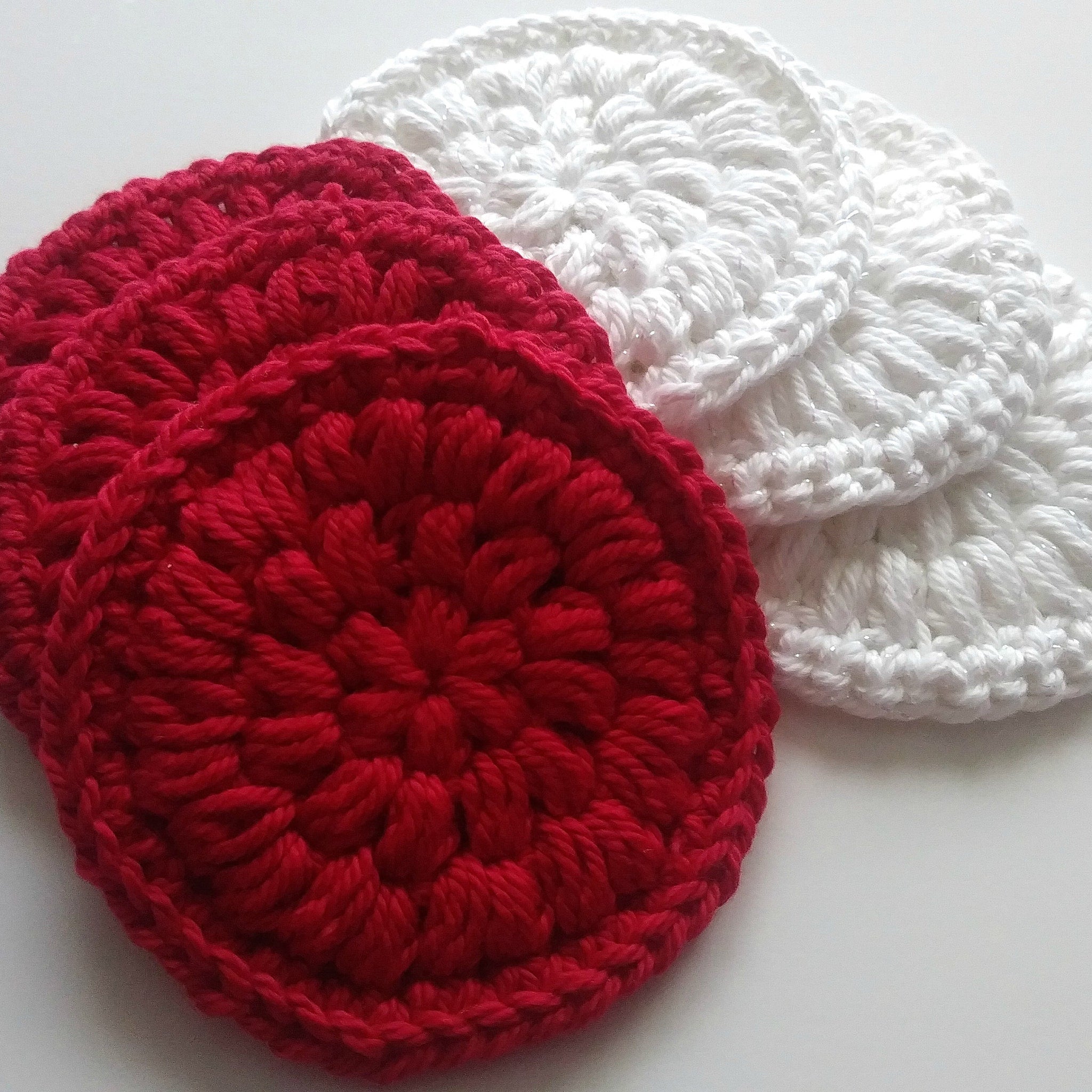 Crochet face scrubbies, red and white yarn, circular pattern, for skincare routine
