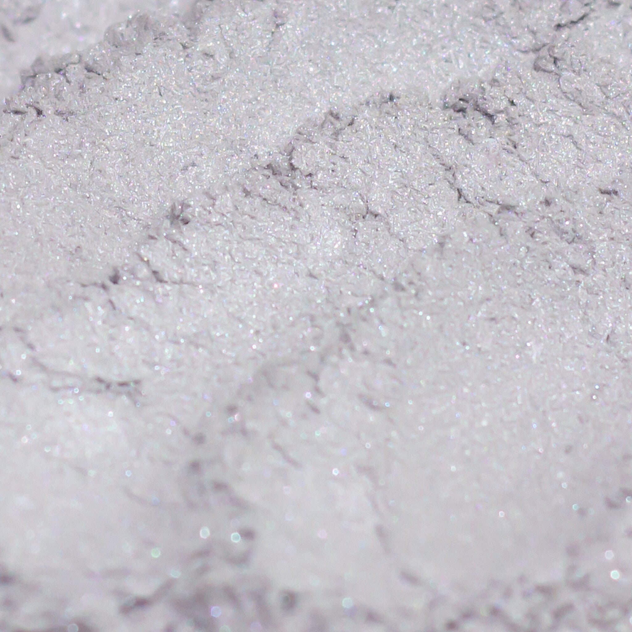 Frosty silver gray eyeshadow pan with lavender shimmer, vegan mineral makeup in compact packaging