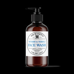 Face wash bottle with brown glass, black pump, and white label with text "Mr Masey's" and "Face Wash