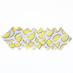 Coasters with yellow paisley pattern on gray fabric, with yellow stitched edges