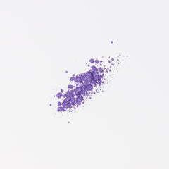 Side view of vegan mineral eyeshadow pot showing natural purple powder with soft shimmer finish