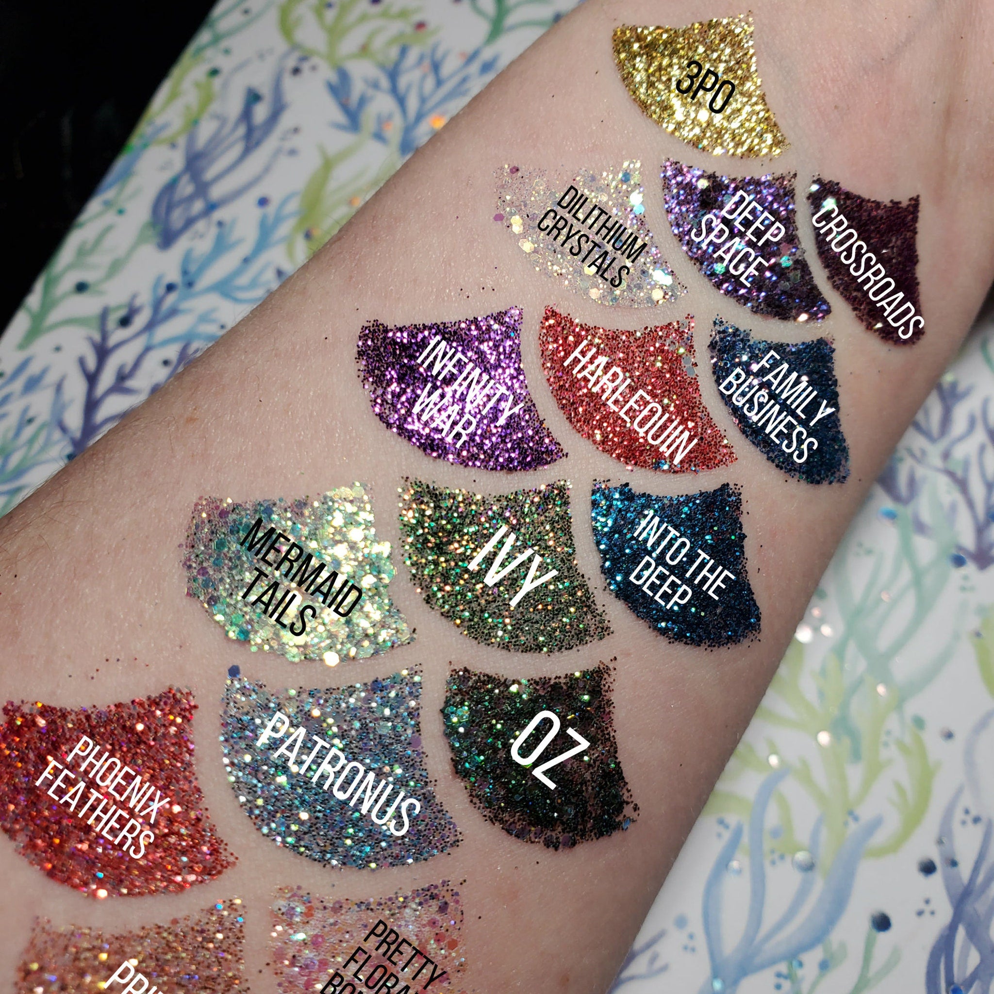 Close-up of vibrant purple glitter eye shadow gel with shimmer particles in a sleek tube