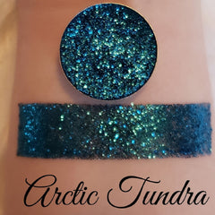 Close-up of Arctic Tundra Glitter Eyeshadow in a magnetic pan with icy blue and silver shimmer particles