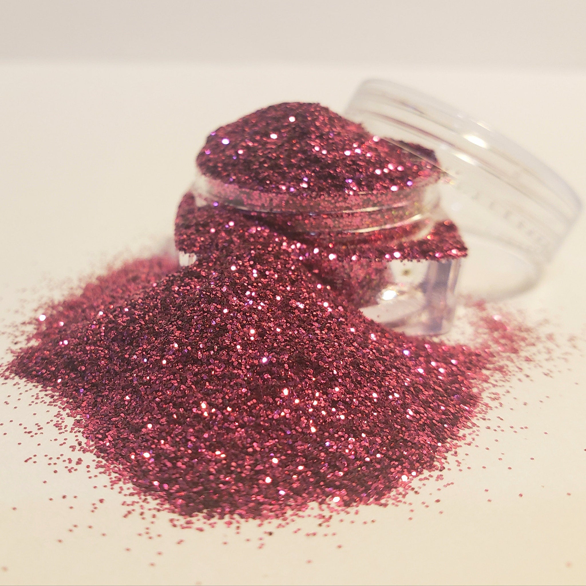 Hand applying Barcelona pressed glitter eyeshadow with a brush, showcasing vibrant pigment and magnetic pan.