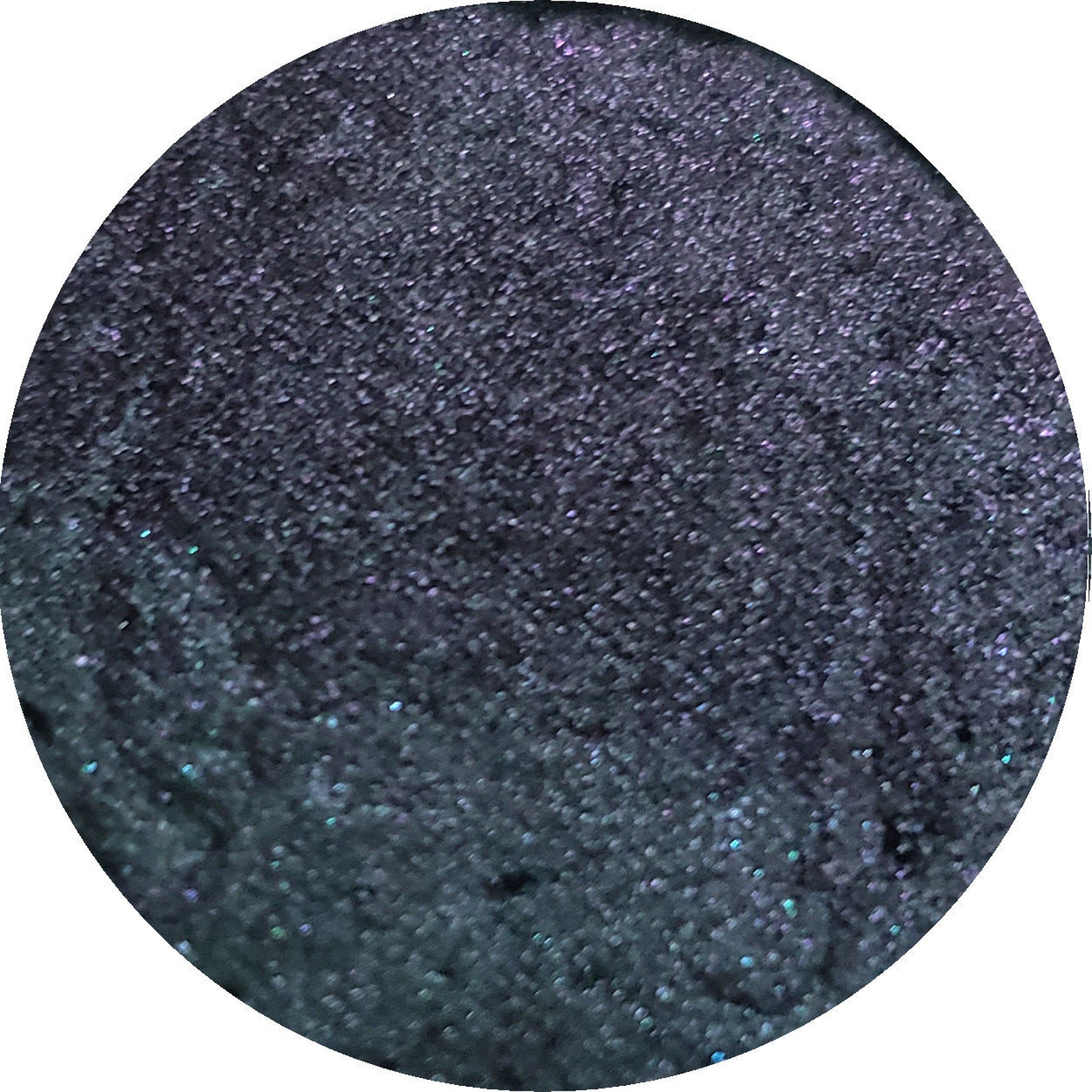 Side view of Fuse Eye Shadow compact showcasing sleek black case with mirrored interior and pressed powder texture