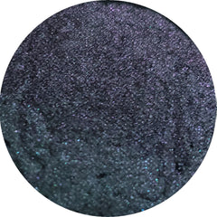 Side view of Fuse Eye Shadow compact showcasing sleek black case with mirrored interior and pressed powder texture