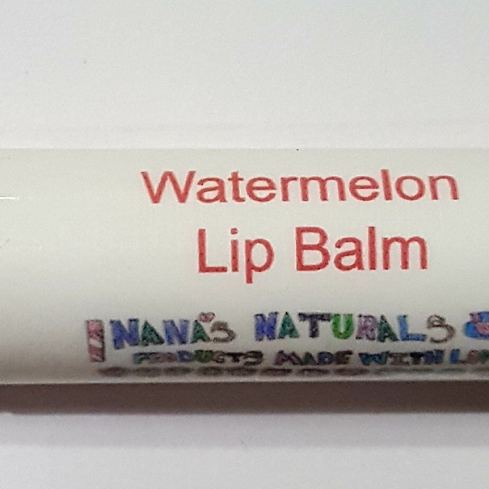 Lip balm tube with white background, red "Watermelon Lip Balm" text, and "Nana's Naturals" logo