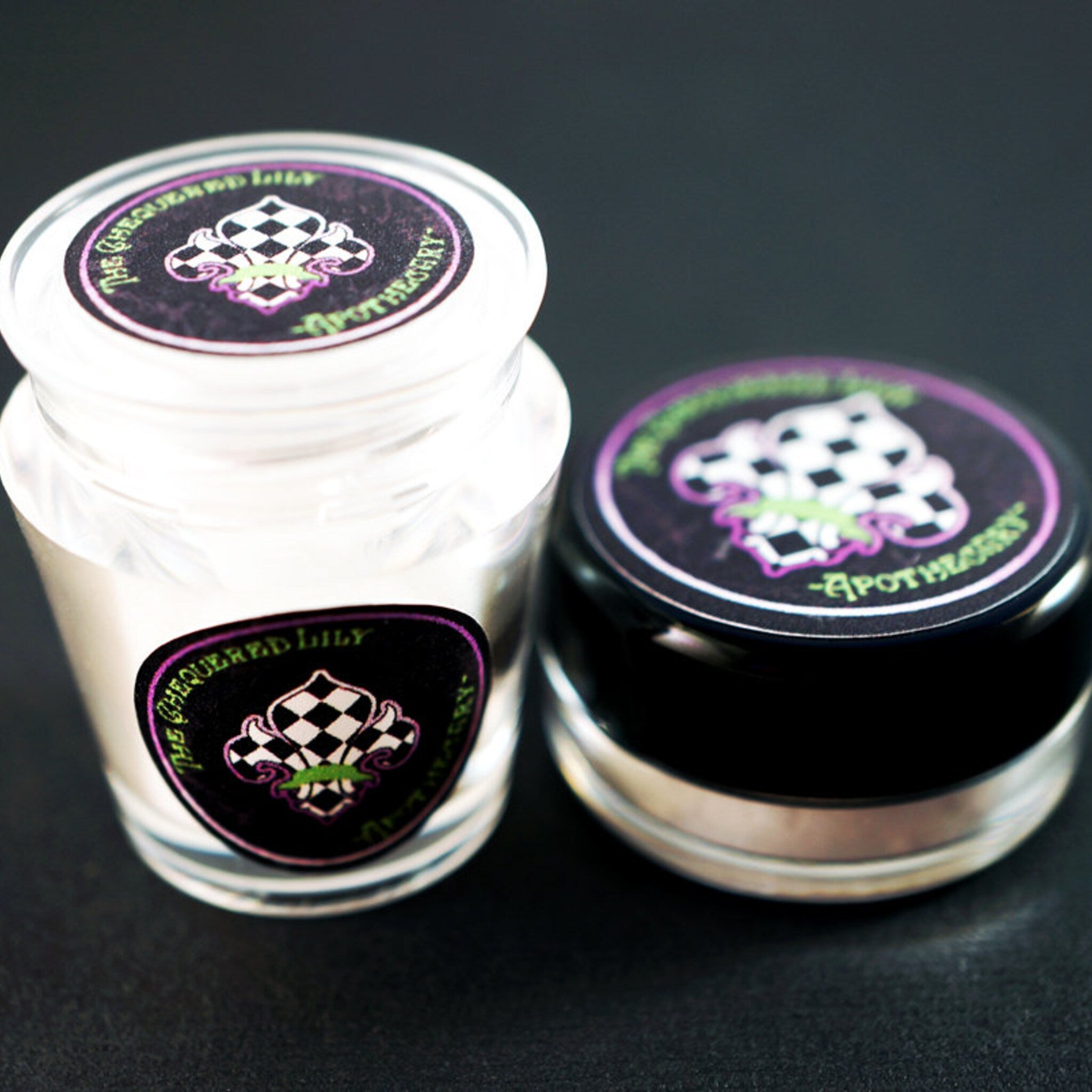 Close-up of blood red loose mineral eyeshadow with intense metallic shimmer in bonus Halloween-themed packaging