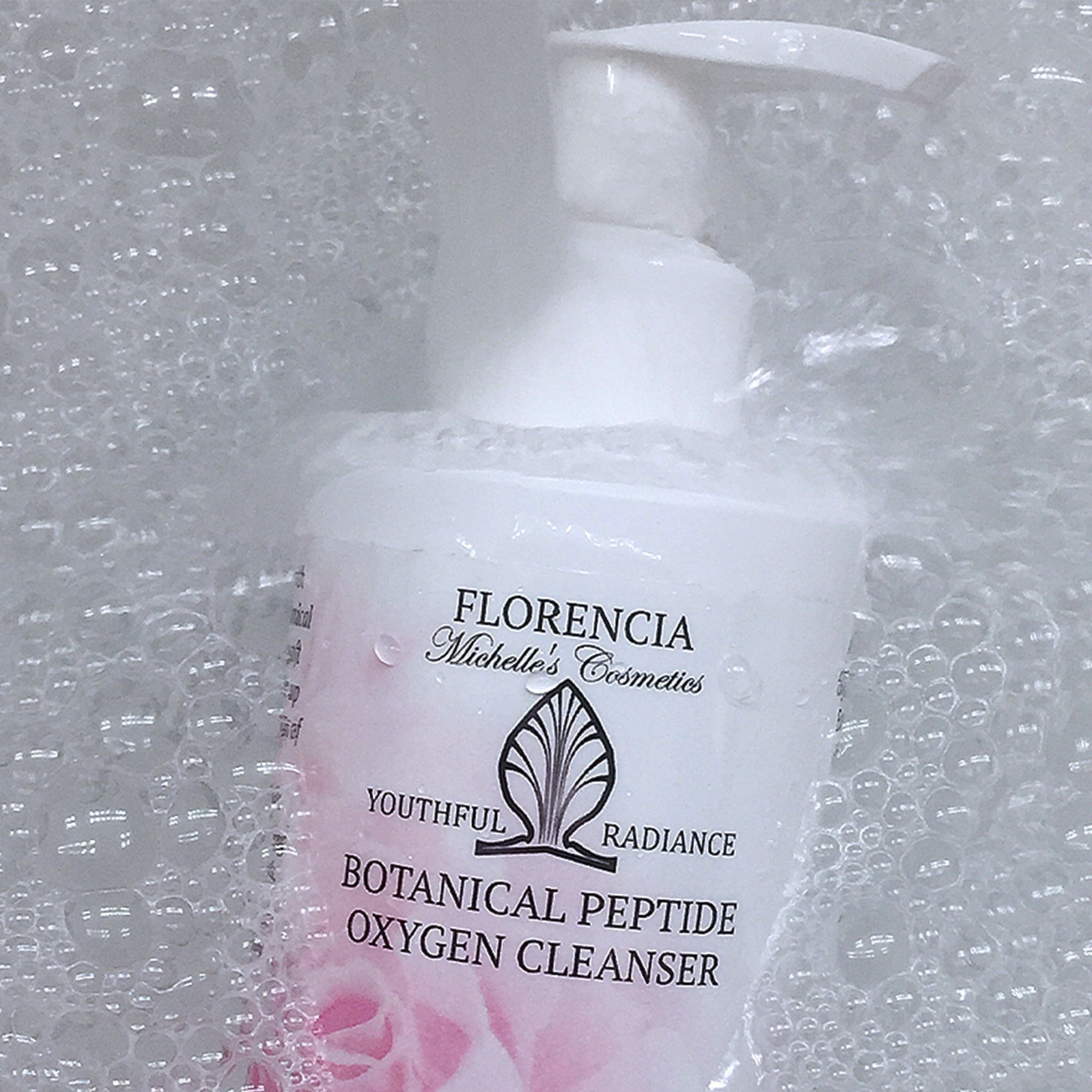 Facial cleanser bottle in white and pink with Florencia brand and bubbles around it