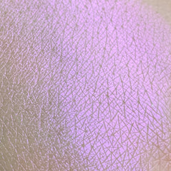 Eye shadow swatch, purple shimmer, skin texture, Tala product sample