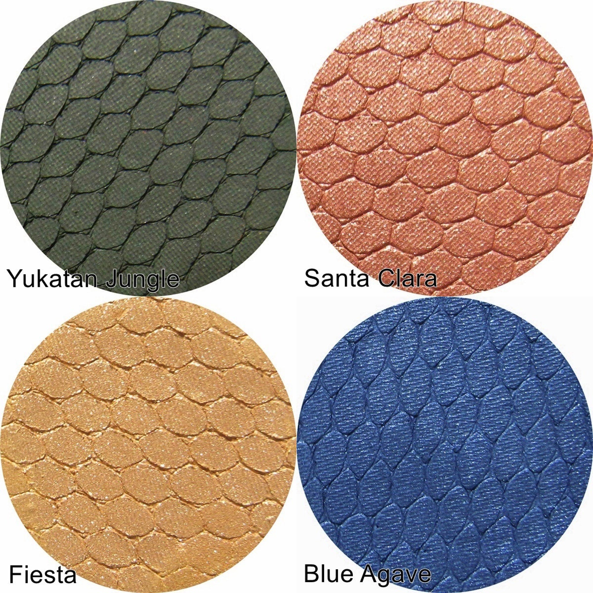 Silk FX Pressed Eye Shadow in Fiesta displayed in sleek black compact with gold logo, open to show vibrant orange shimmer pan.