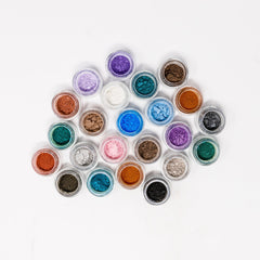 Close-up of matte purple mineral eyeshadow pan with smooth pressed powder texture and vegan label visible