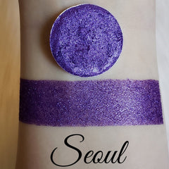 Seoul Shimmer Eyeshadow pot with reflective mineral pigment in a pressed powder finish, showcasing pearlescent hues.