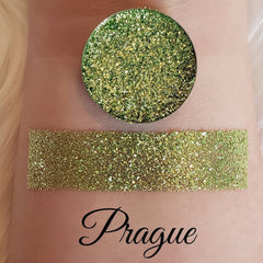 Close-up of pressed glitter eyeshadow in a magnetic pan with vibrant shimmer particles