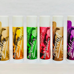 Lip balm tubes with white caps, colorful labels, and text "Windrift Hill" on each tube