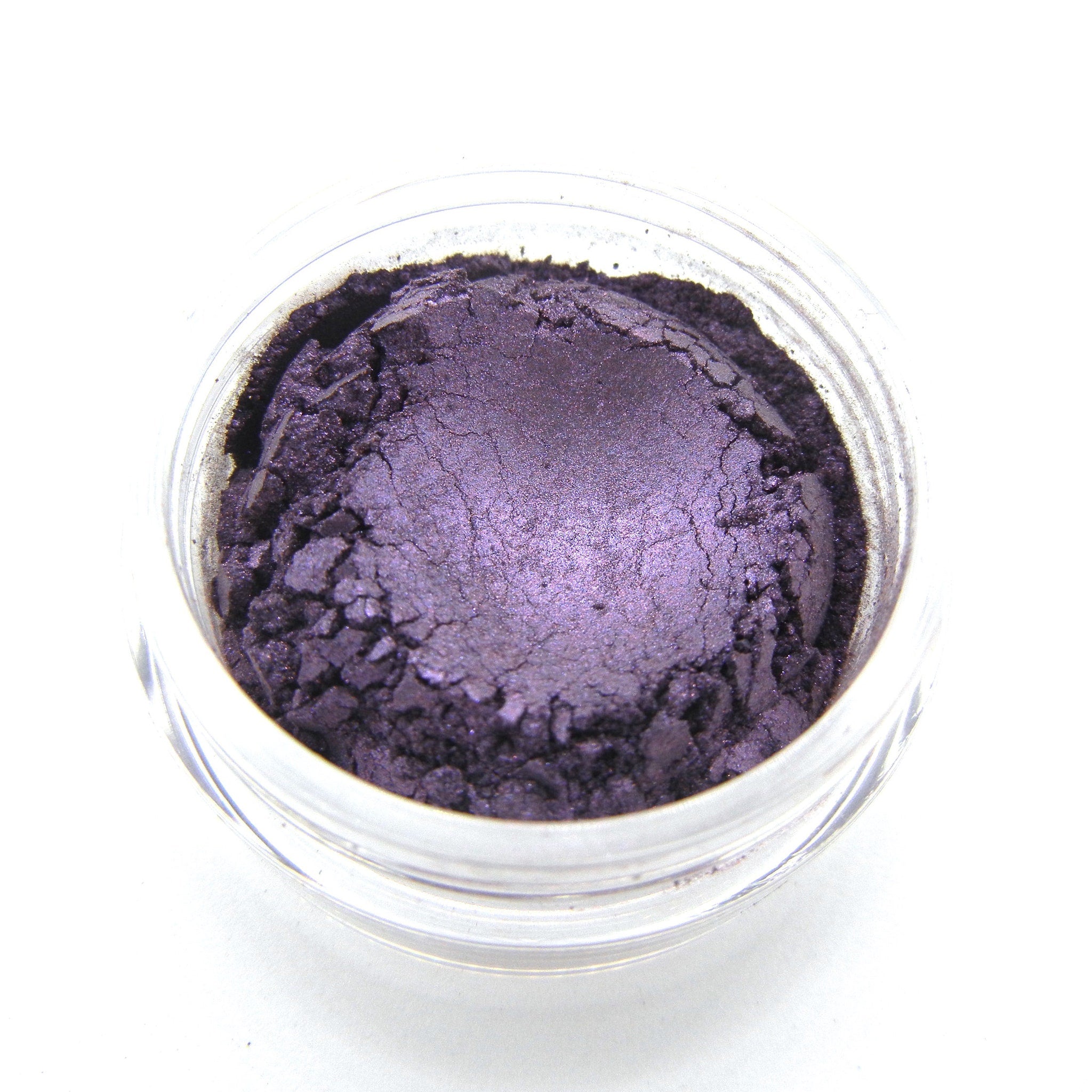 Side view of dark purple vegan mineral eye shadow pot showing matte finish and compact size