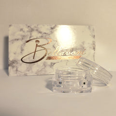 Clear plastic jar with lid, marble pattern box with gold "Bellavoni" text