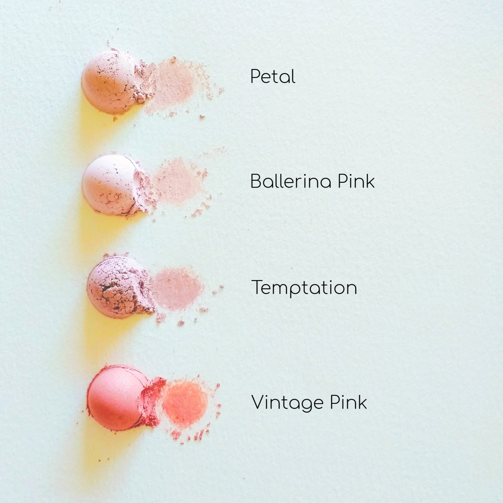 Pink blush swatches with various shades and textures on white background