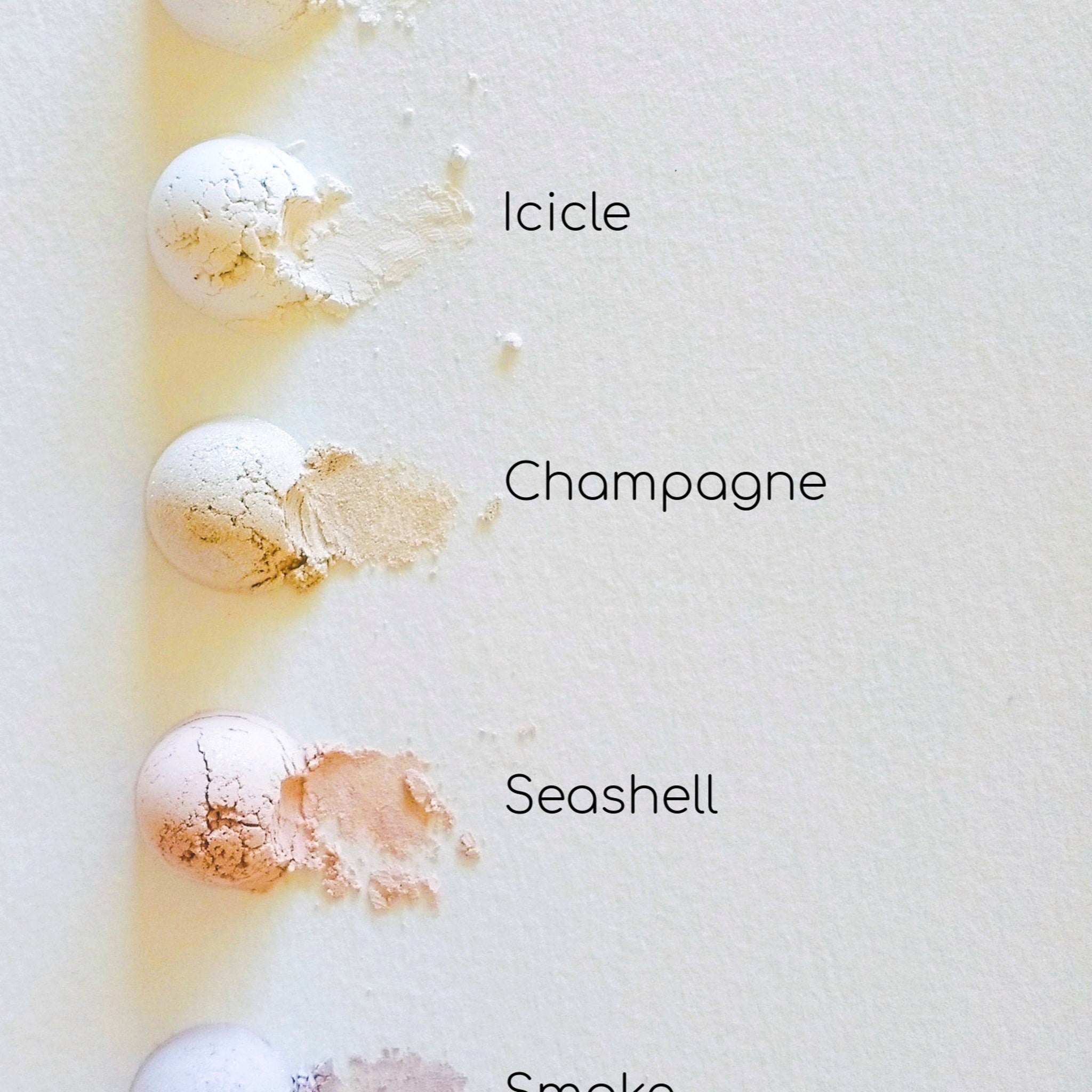 Powder samples with white, tan, and pink colors on white background, Elemental Beauty text