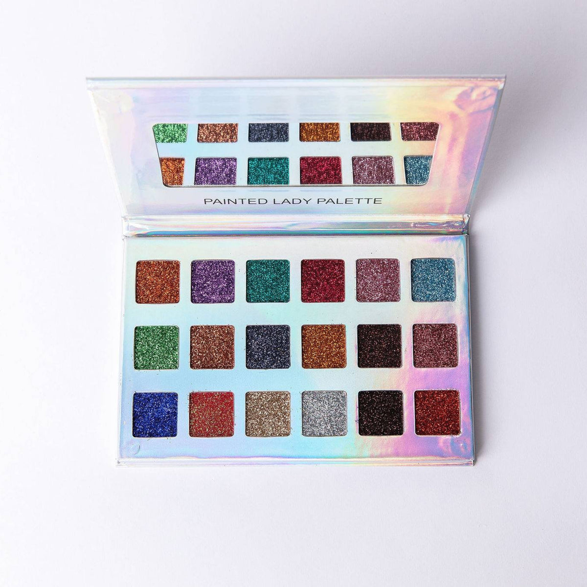 Painted Lady glitter eyeshadow palette with six vibrant shades in a sleek black compact