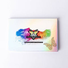 Side view of Painted Lady glitter eyeshadow palette showcasing vibrant metallic shades in gold, pink, and purple hues