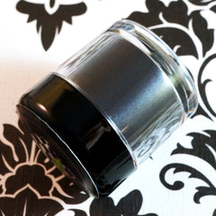 Swatch of iridescent gunmetal shimmer on skin showing metallic black loose mineral pigment blend
