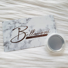 Bellavoni cosmetics card with marble pattern and metallic container on white fur background