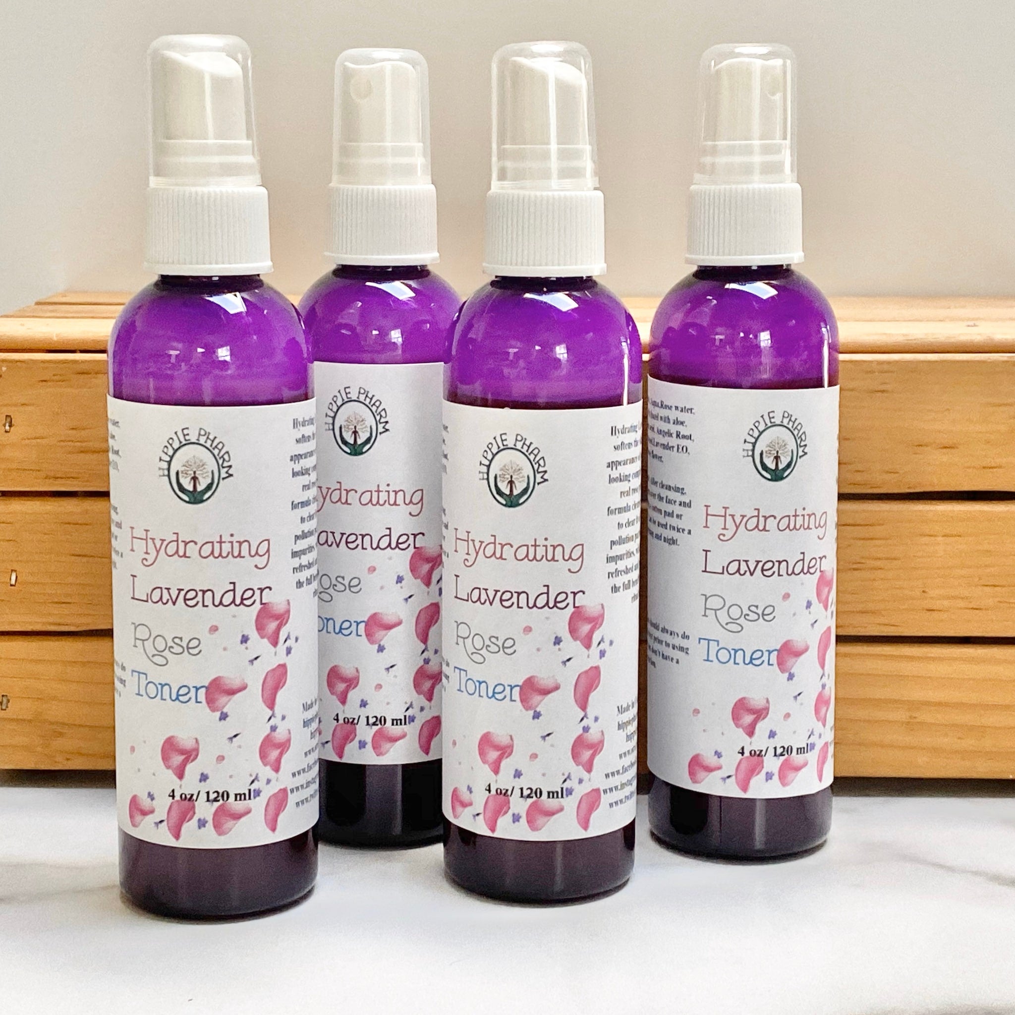 Rose Toner bottles, purple liquid, white label with Hippie Pharm branding and floral design