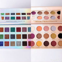Close-up of fingertips applying shimmering bronze and plum eyeshadow from duo palette onto eyelid