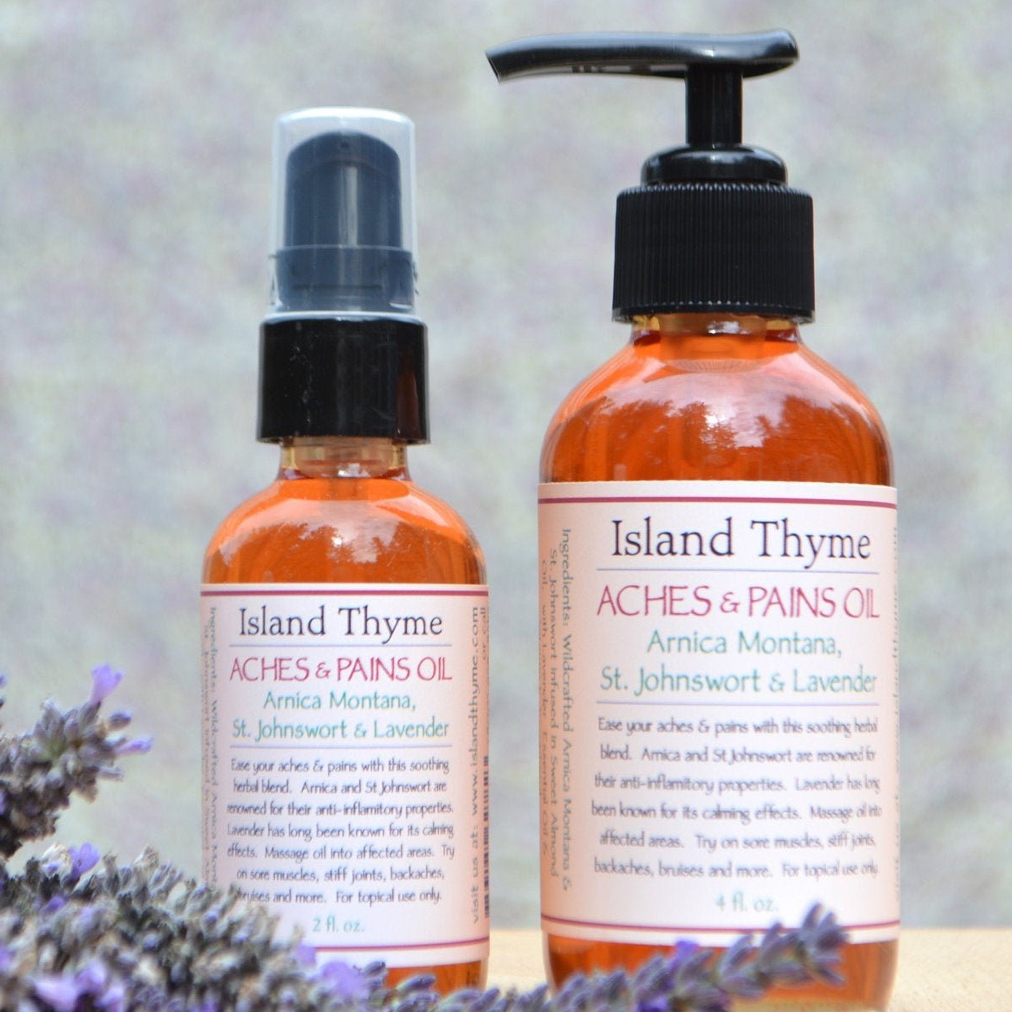 Aches & Pains Oil, amber glass bottles with black caps, Island Thyme label visible