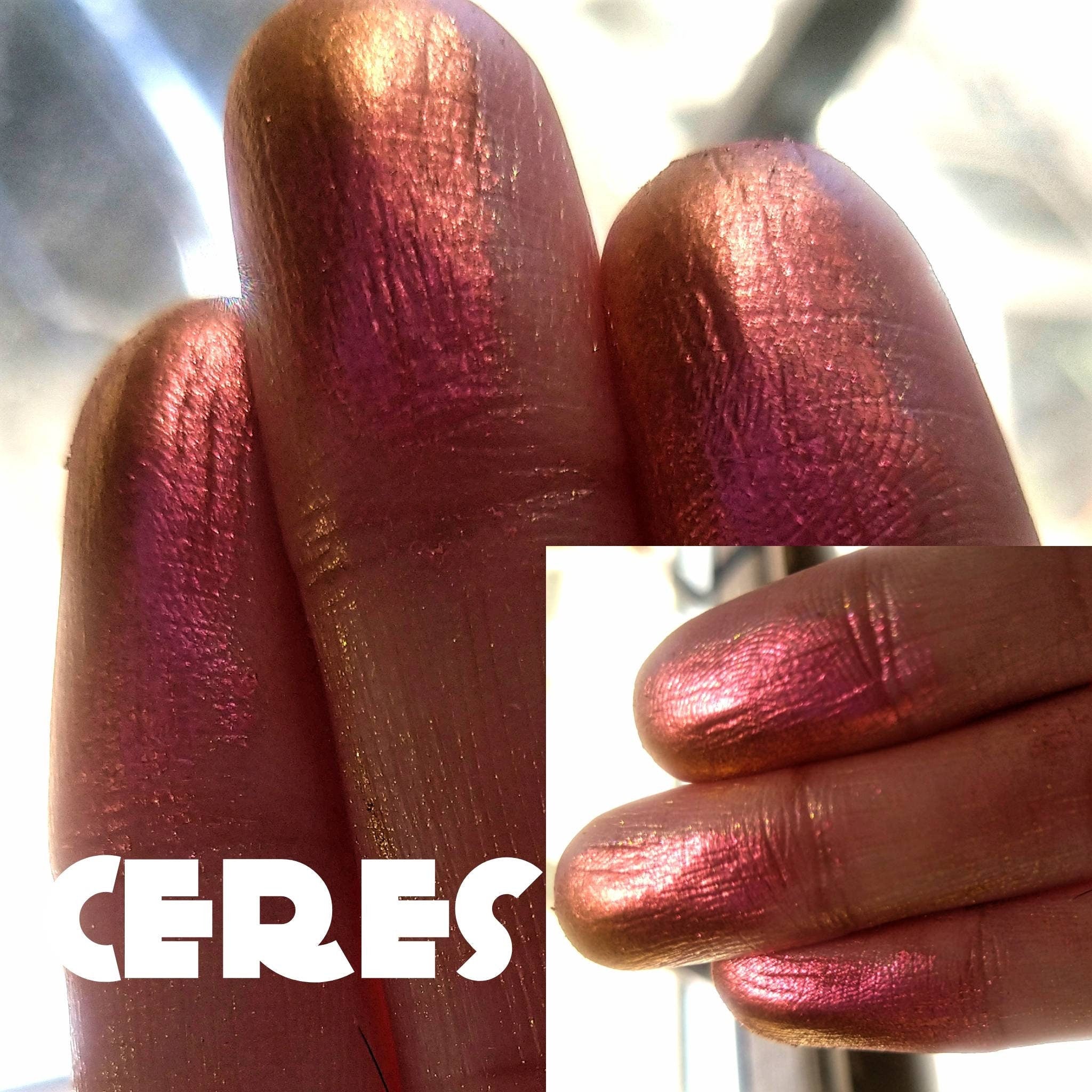 Open compact showcasing NEBULA Collection Ceres Multichrome Eyeshadow with chameleon orange-pink-gold-violet shift