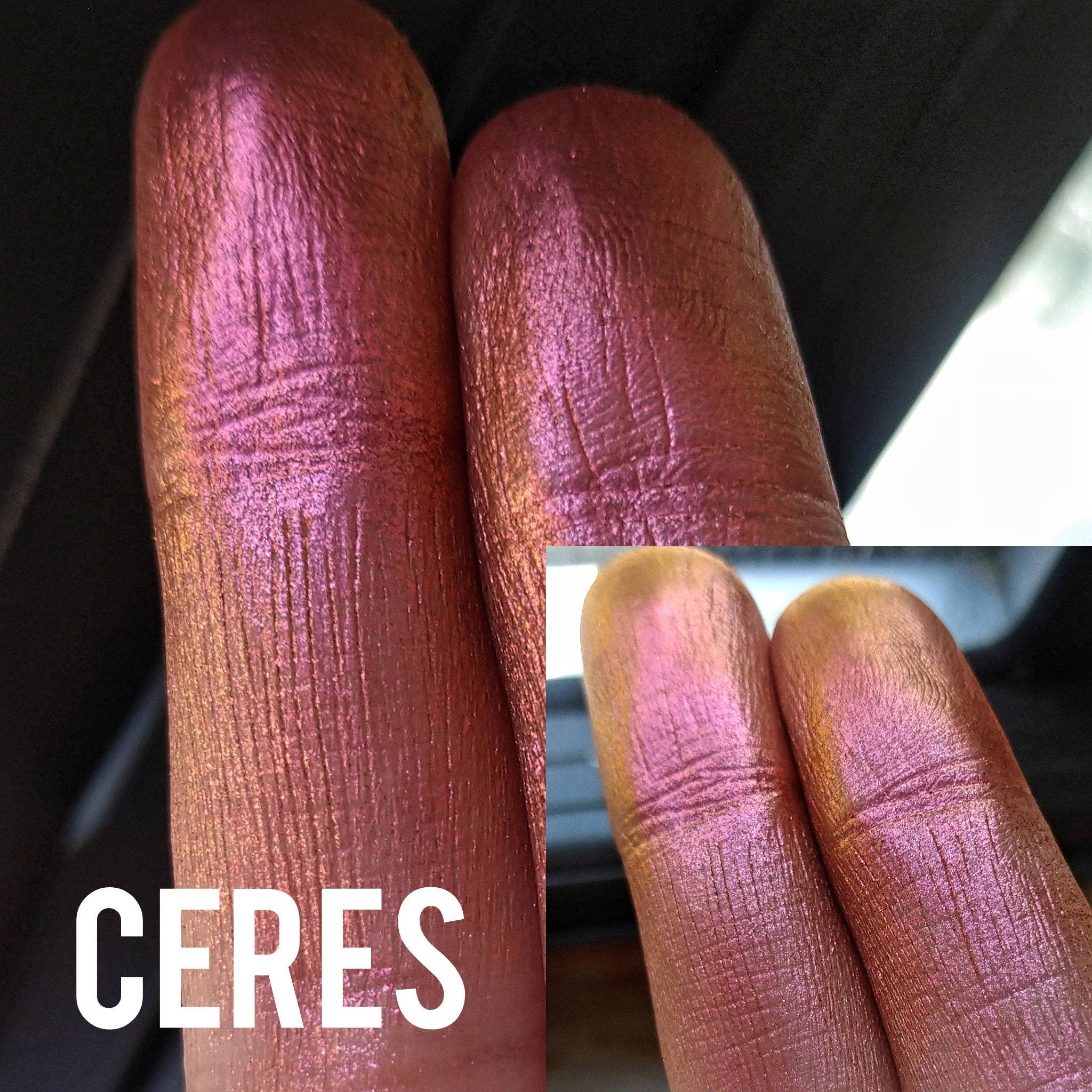 Hand applying NEBULA multichrome eyeshadow in chameleon orange-pink-gold-violet shift to eyelid