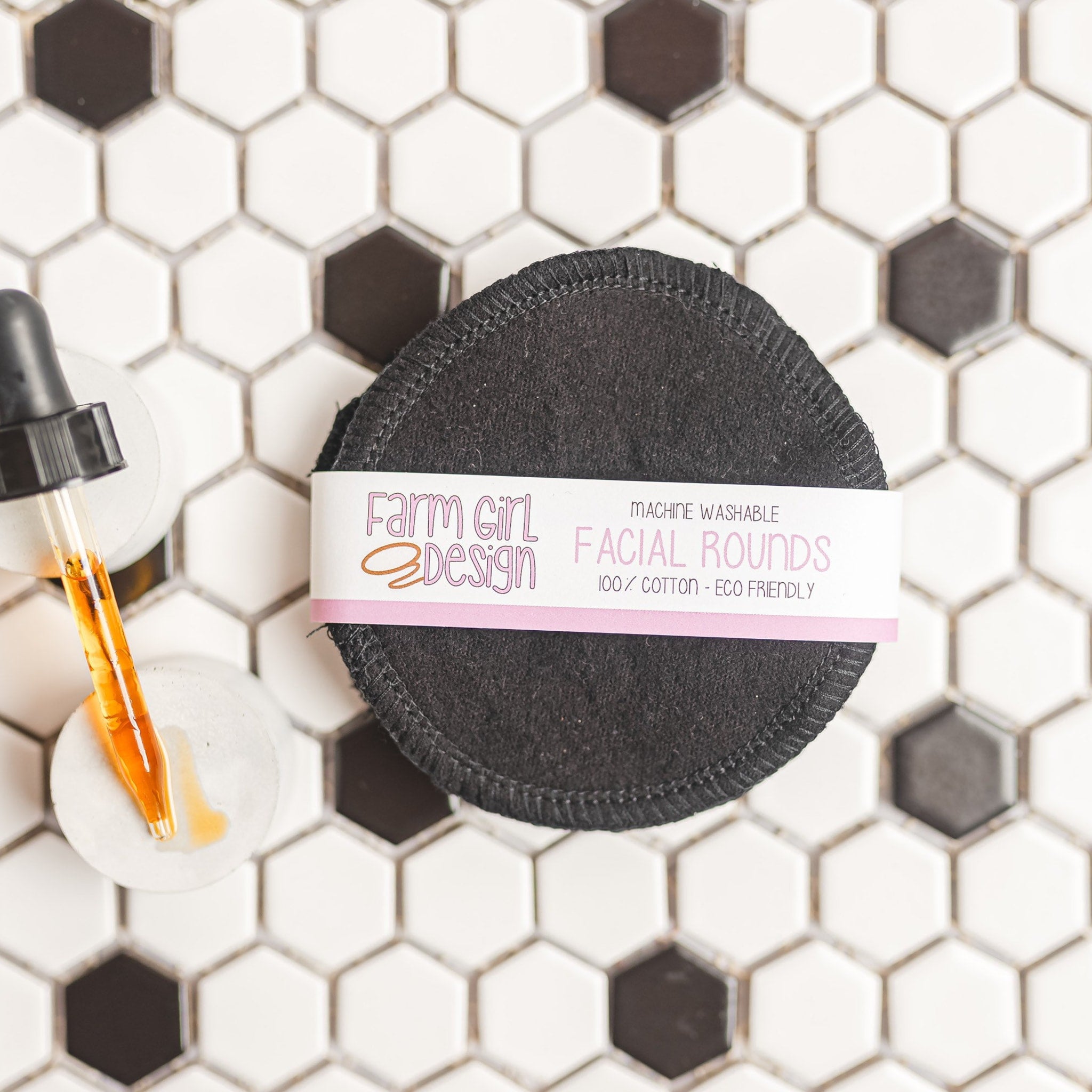 Facial rounds, black cotton pads with stitched edge, Farm Girl Design label visible