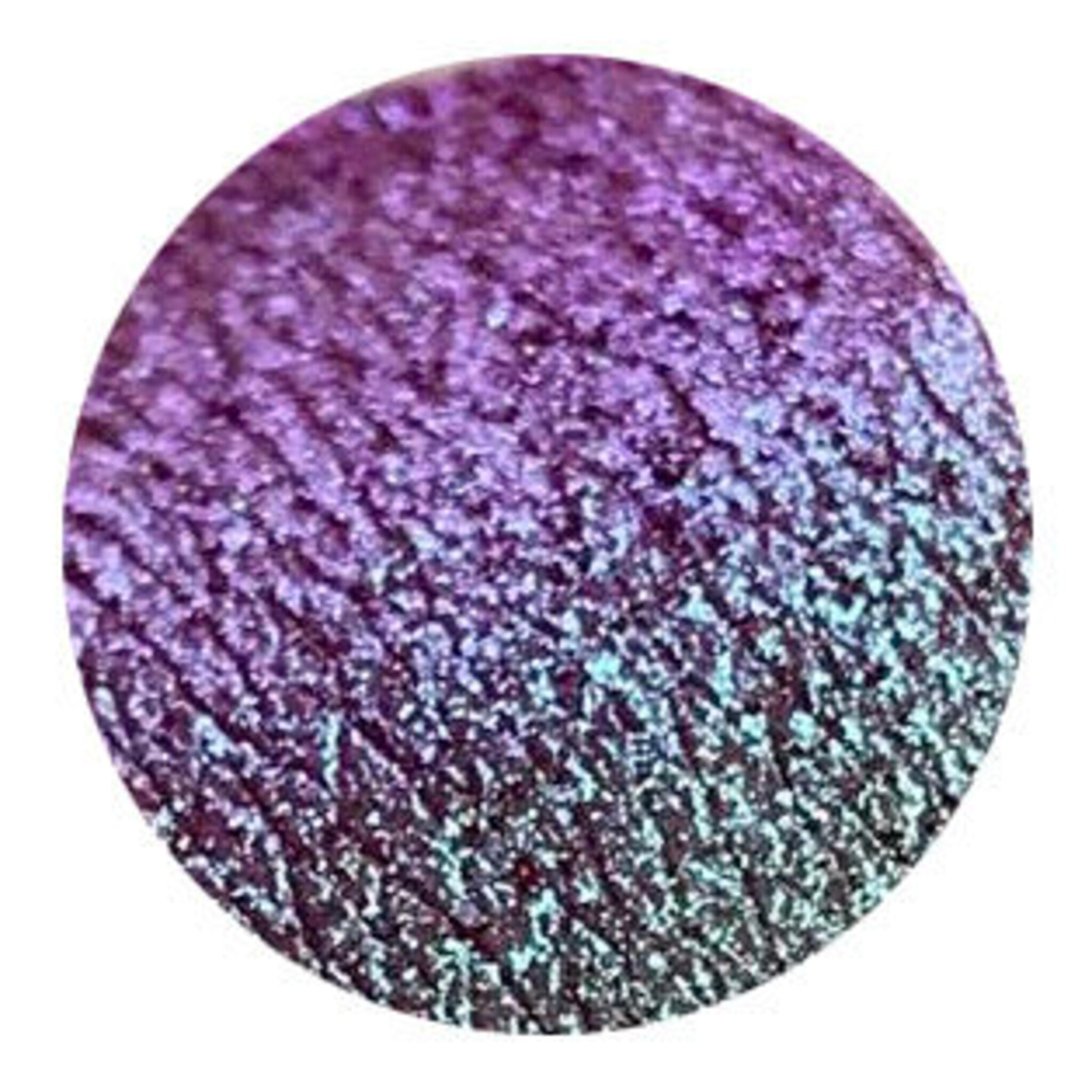 Close-up of Tala Sparkle Mermaid Eye Shadow pot showing iridescent teal and purple powder shimmer