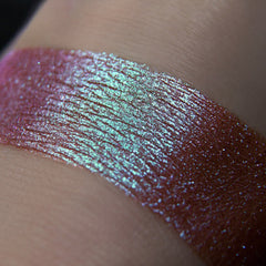 Side view of Tala Sparkle Mermaid Eye Shadow pot showing iridescent turquoise and purple shift