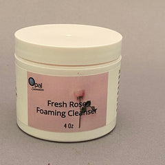 Foaming cleanser jar, off-white plastic, pink label with text and floral image, Opal Cosmetics brand