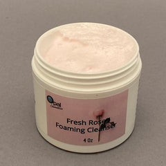 Foaming cleanser jar with pink cream, white container, and Opal Cosmetics label