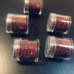 Single pan of vibrant pomegranate red eye shadow with smooth satin finish in black compact.