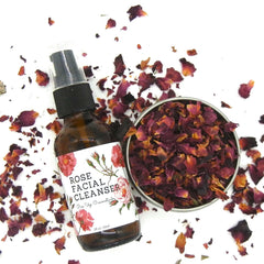 Rose Facial Cleanser brown glass bottle with label, rose petals, and Pin Up Cosmetics text