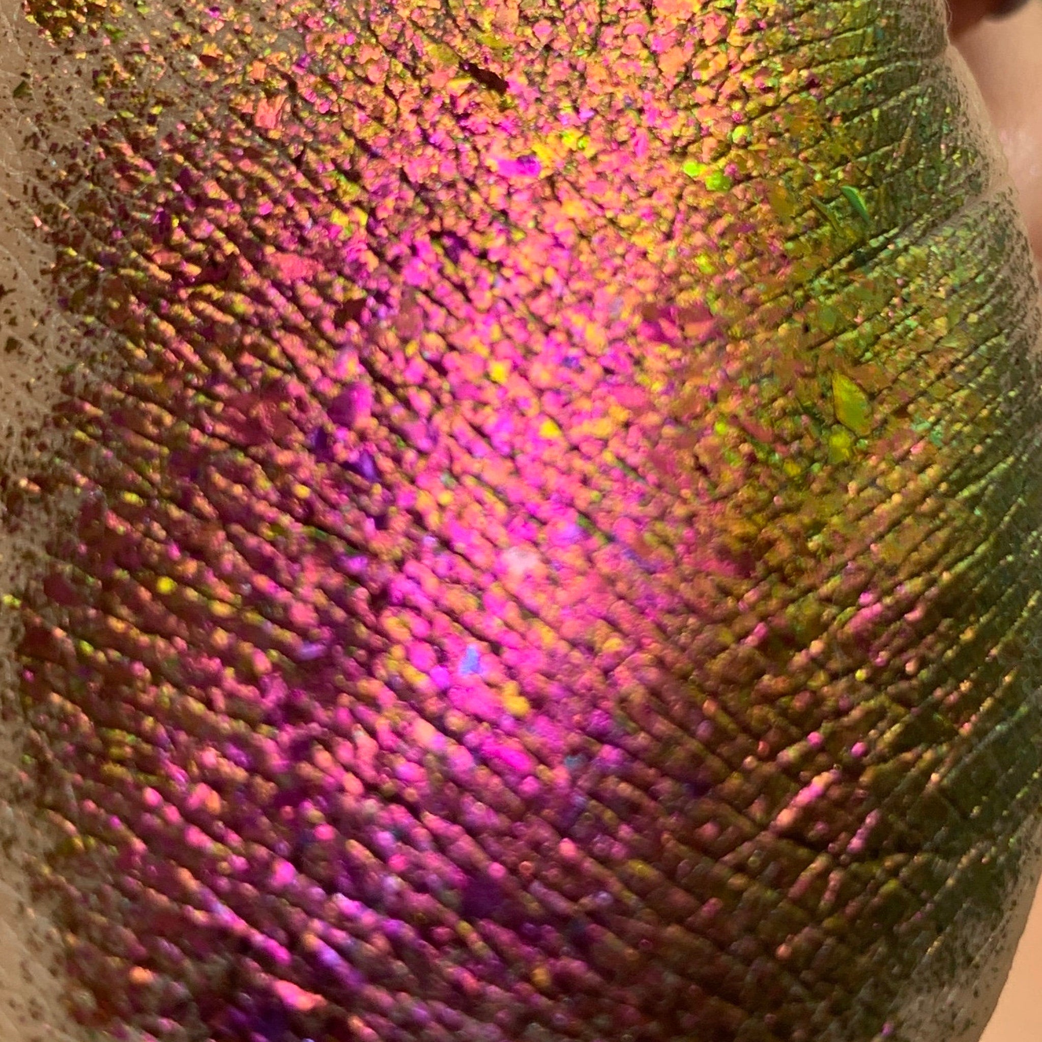 Tala Foil Eye Shadow Pigment in Rose Petals shown in sleek black tube with gold cap, placed on marble surface