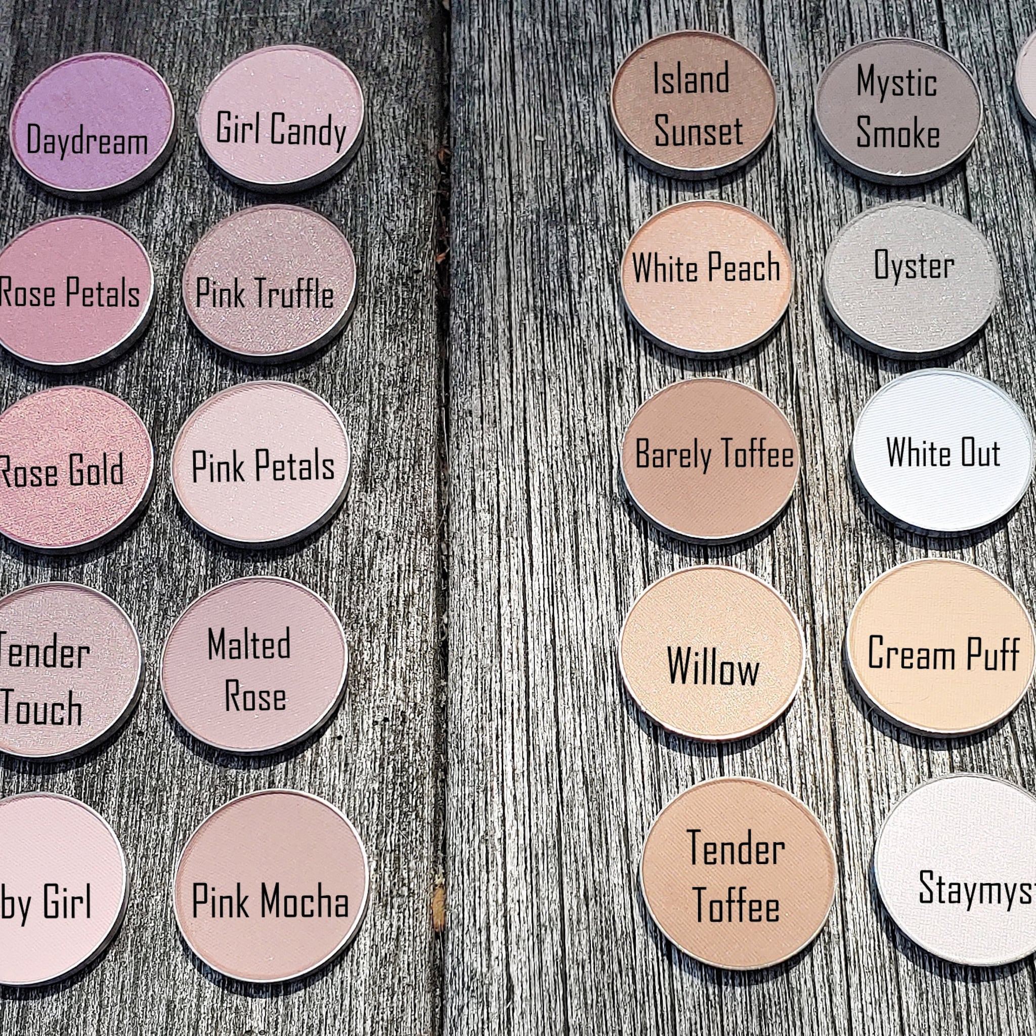 Eyeshadow palette with pink, beige, and purple colors, circular pans, and brand names visible